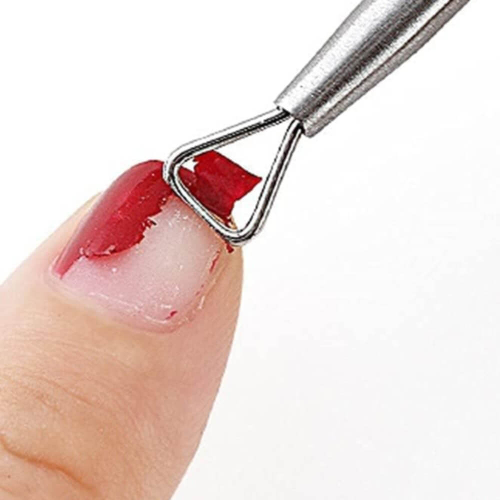 Gel Remover Tool Scrapping Off Softened Gel From Finger Nail