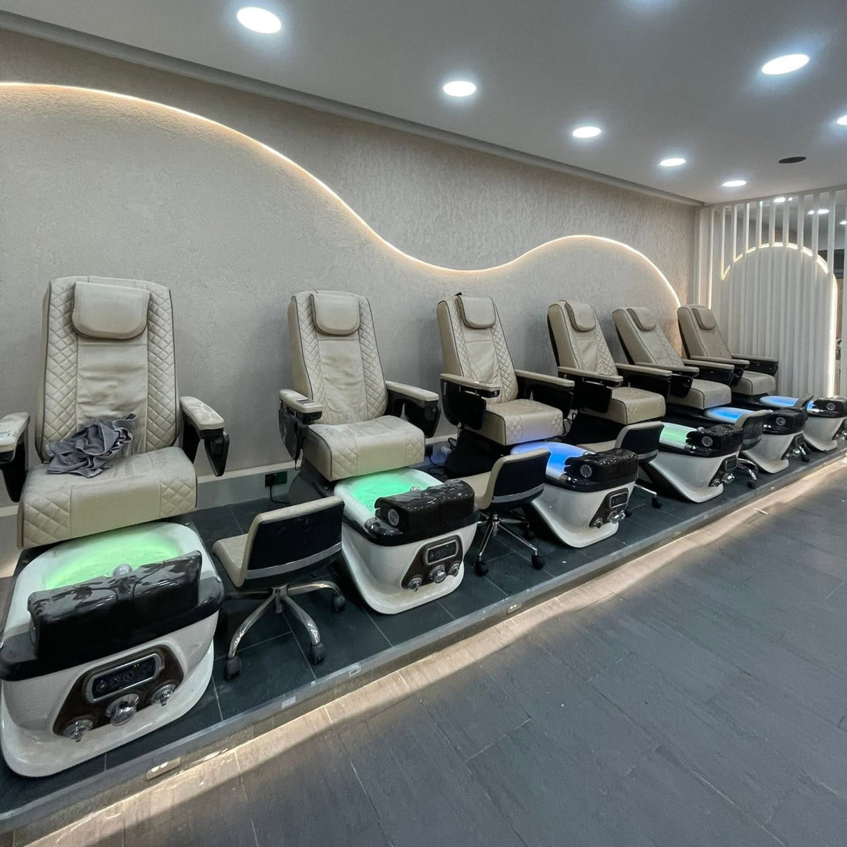 Lexor PSD700 Salon Pedicure Spa Chairs installed in a new salon premises, featuring  six spa chair units sets supplied and fitted by Keo Supply.