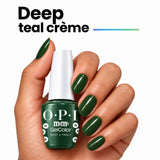 OPI Intelli-Gel | What a Tree-t (GCT HP T10) Hand With Bottle Showing The Deep Teal Creme Shade On The Finger Nails